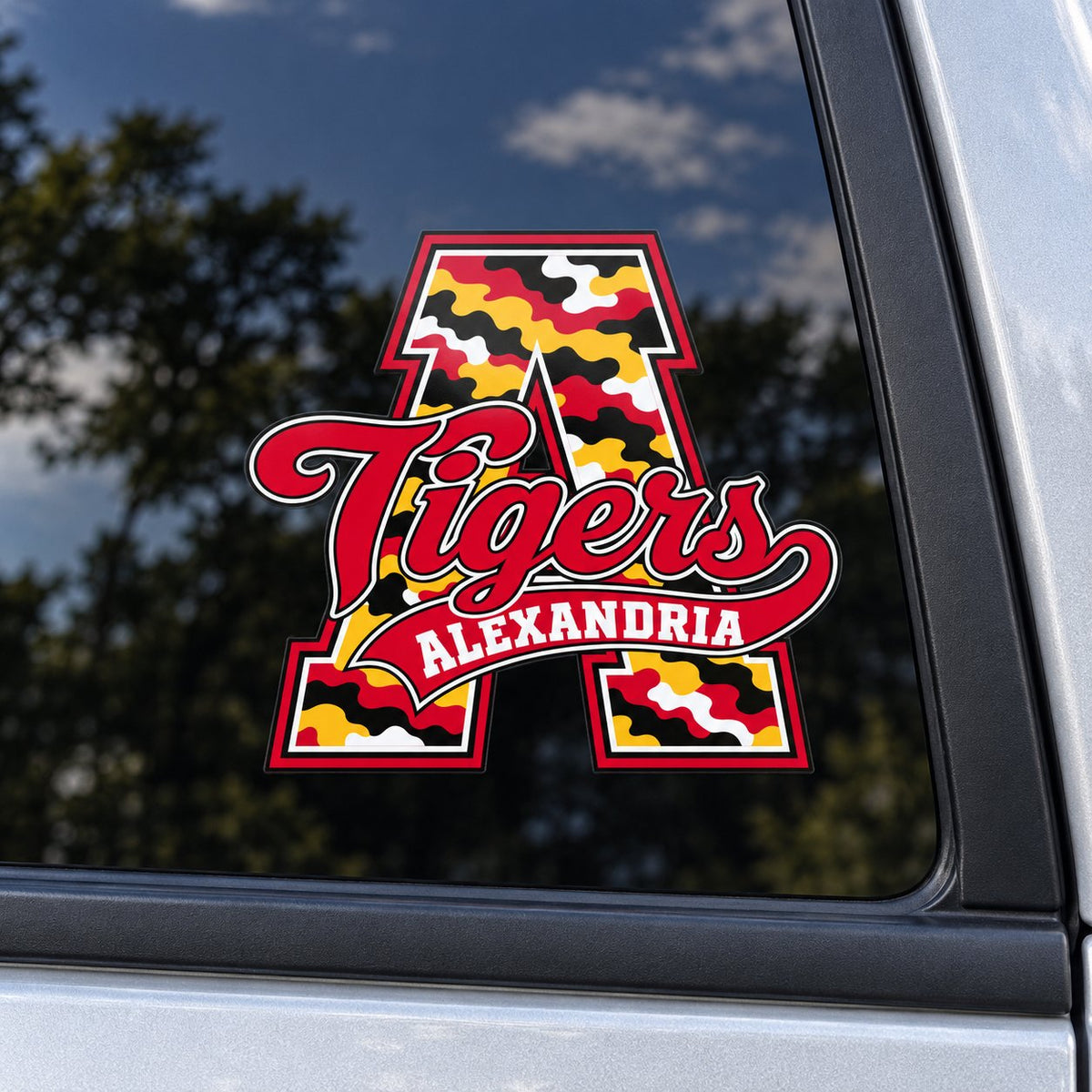 Alexandria Tigers camo script A vehicle decal on a car window.